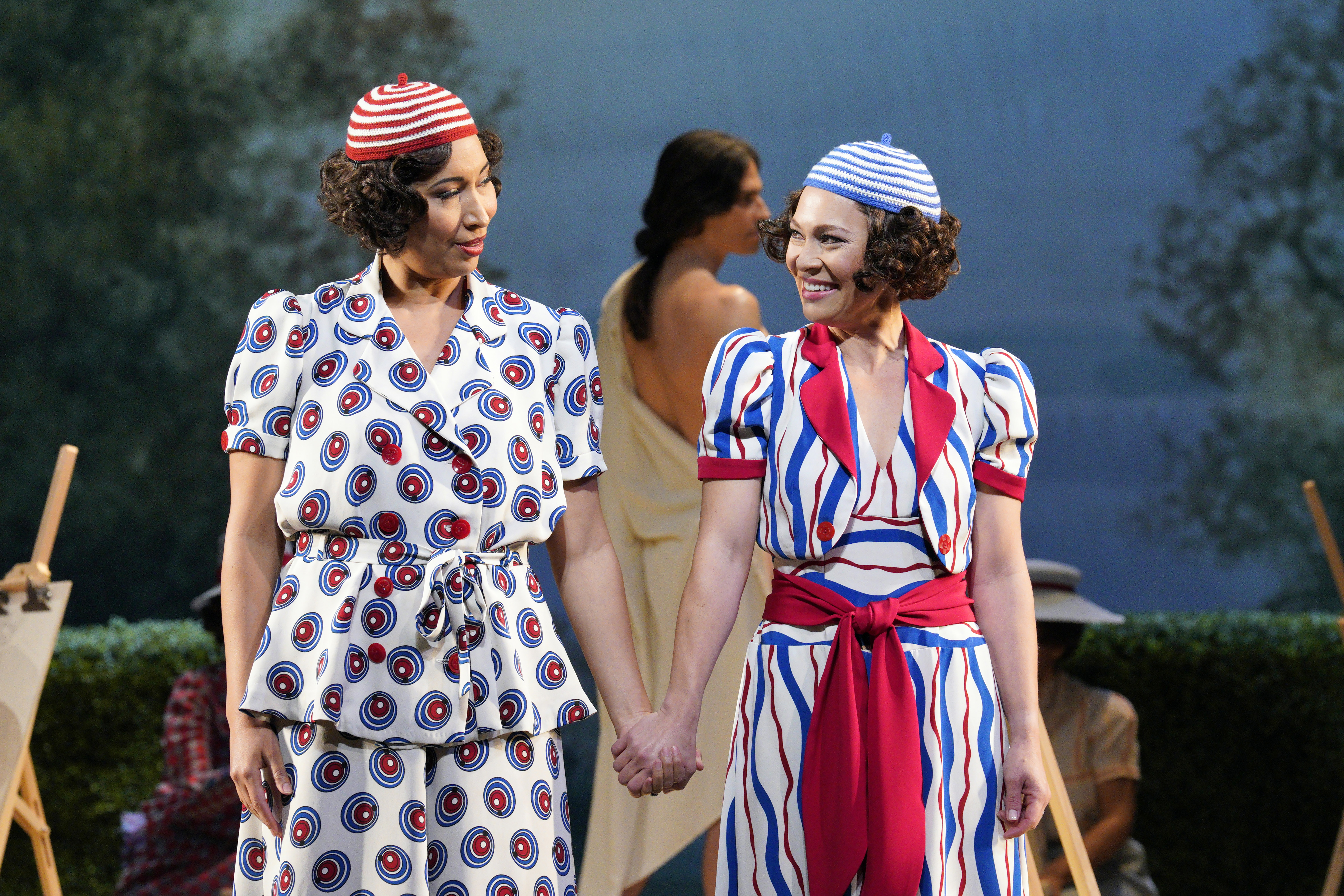 Two women holding hands